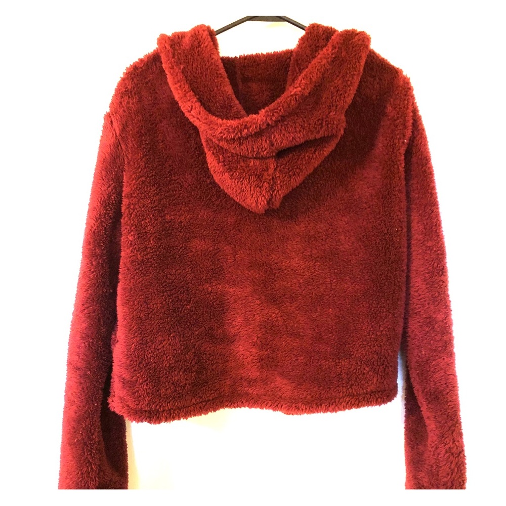 Cozy fur-like red sweater from a boutique